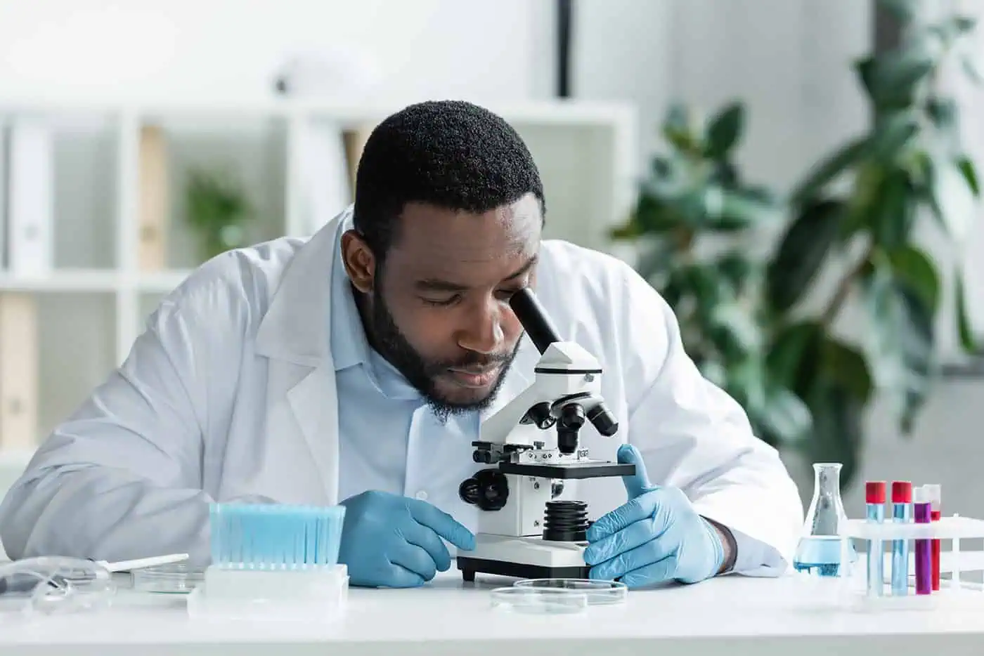 africanamericanscientistinlatexglovesworkingwithstethoscopetest-2